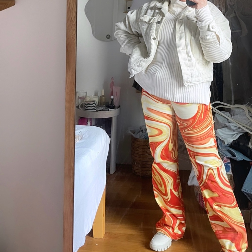 HOSBJERGVILMA PANG Vibrant Red and Yellow Trousers with Psychedelic Pattern
